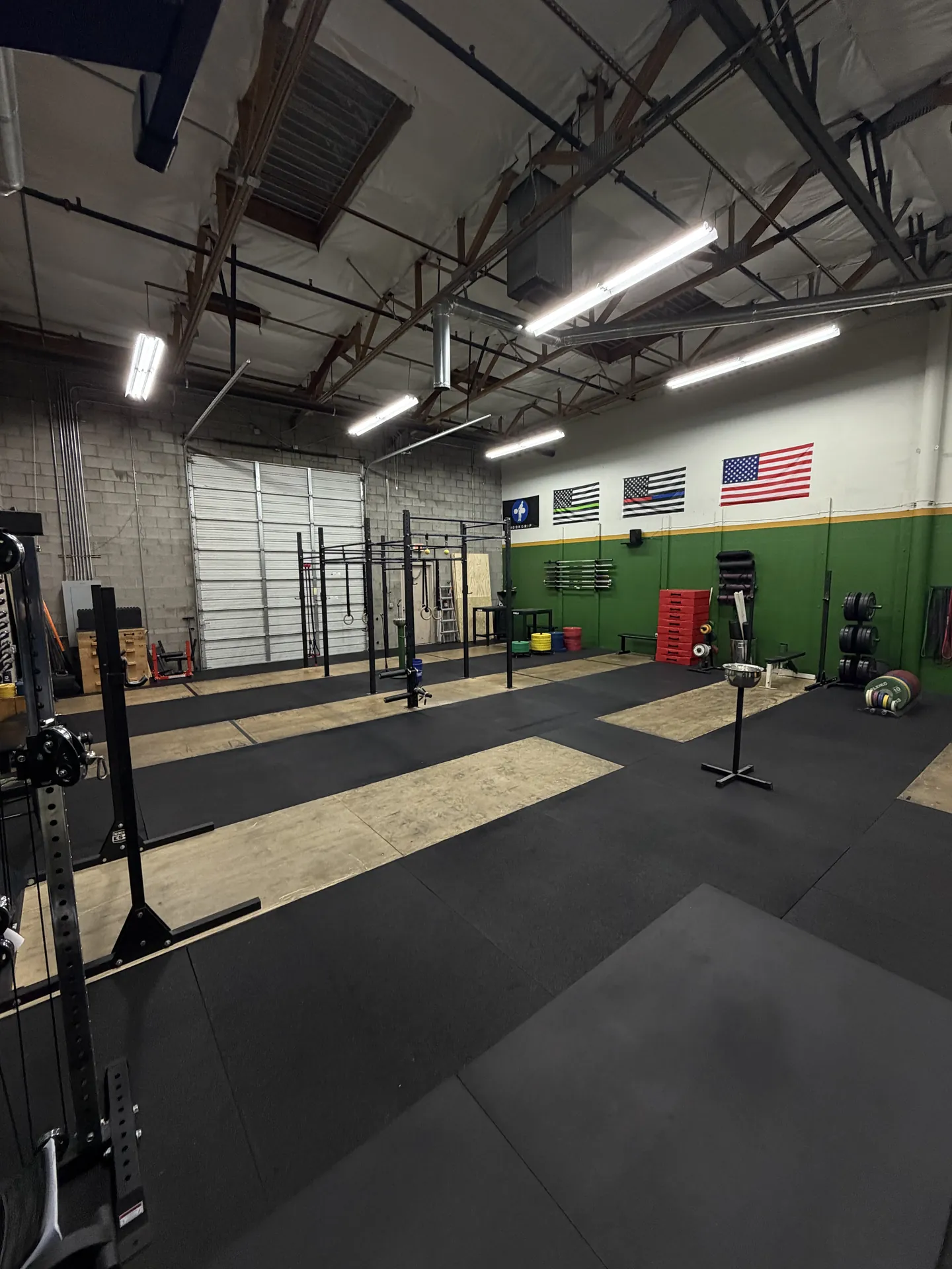 Open lifting platforms and training space at Atlas Barbell Club