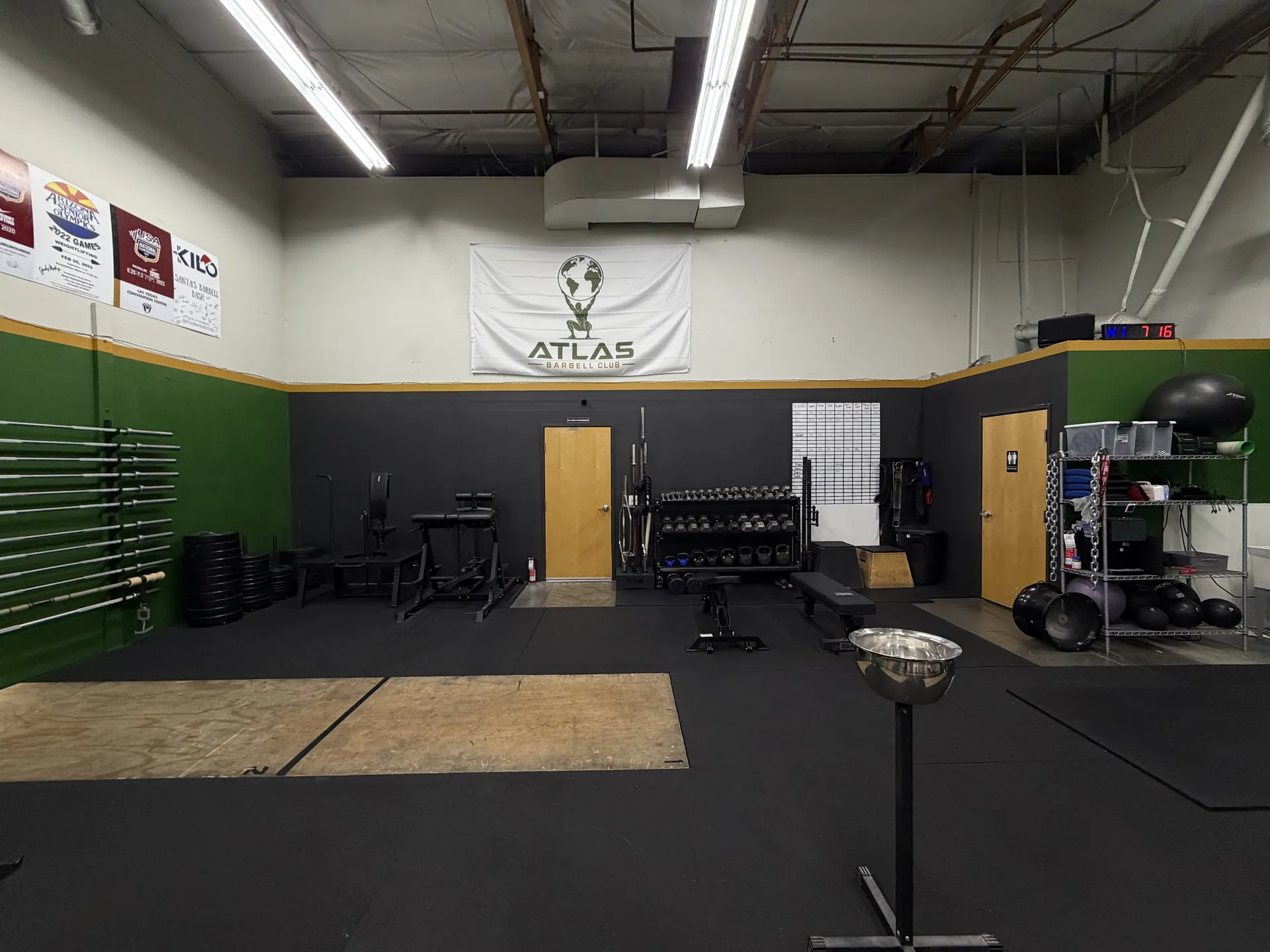 Atlas banner above the strength equipment and platforms